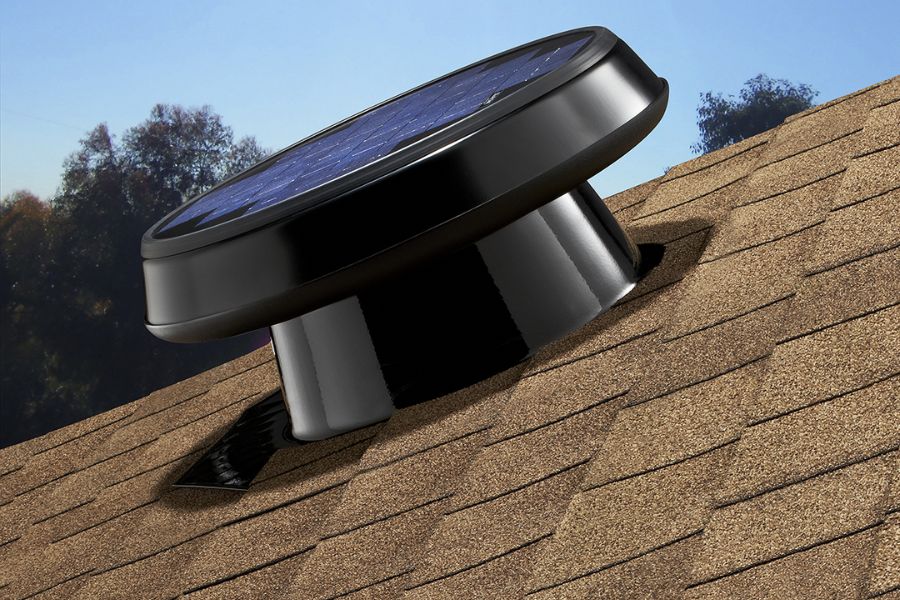 Natural light solar attic fan on house roof