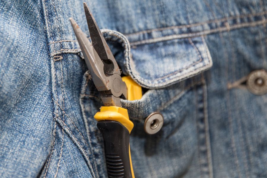 A plier in jeans jacket's pocket