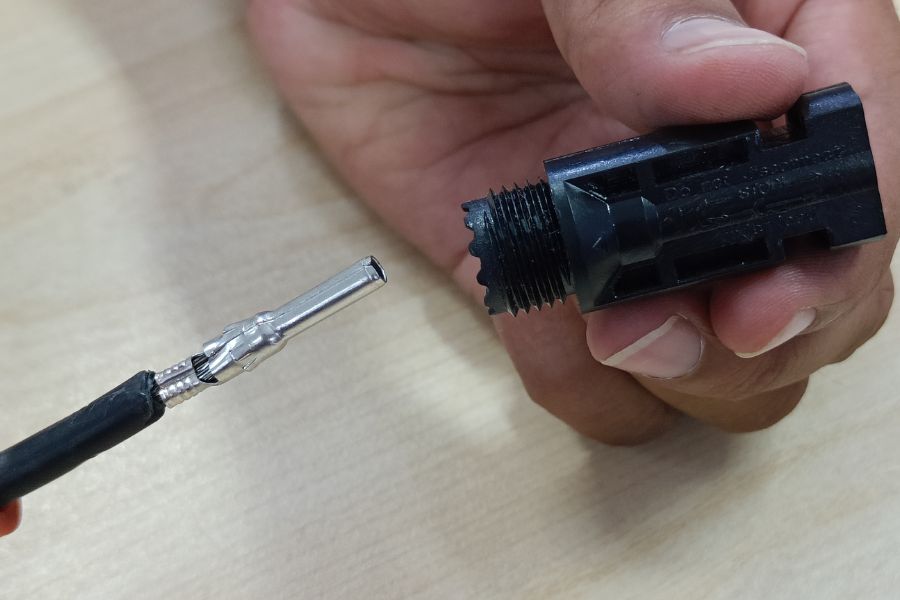 Insert the male pin into the open end of the female connector